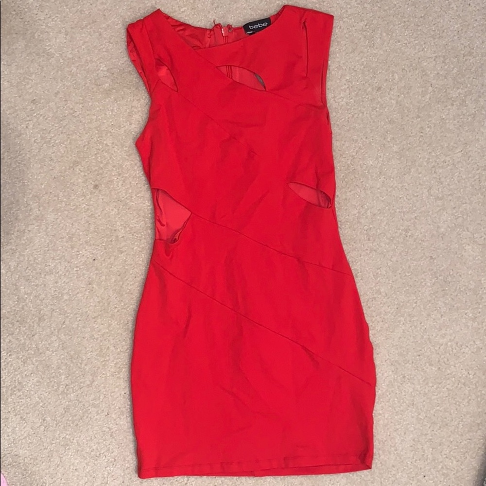 Bright red Bebe cut out bodycon dress.